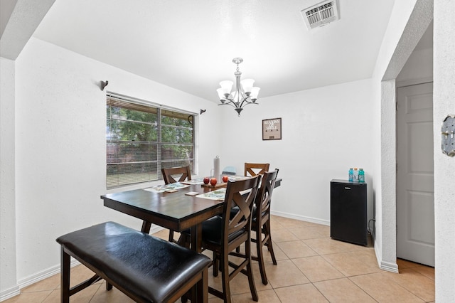 9207 Loren Ln, Houston, TX 77040 - dining area featuring a chandelier, light tile patterned flooring, and baseboards