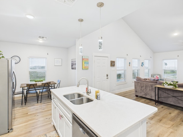 2403 S Bronte St, Rockport, TX 78382 - kitchen featuring a sink, stainless steel appliances, light wood-style flooring, plenty of natural light, and high vaulted ceiling