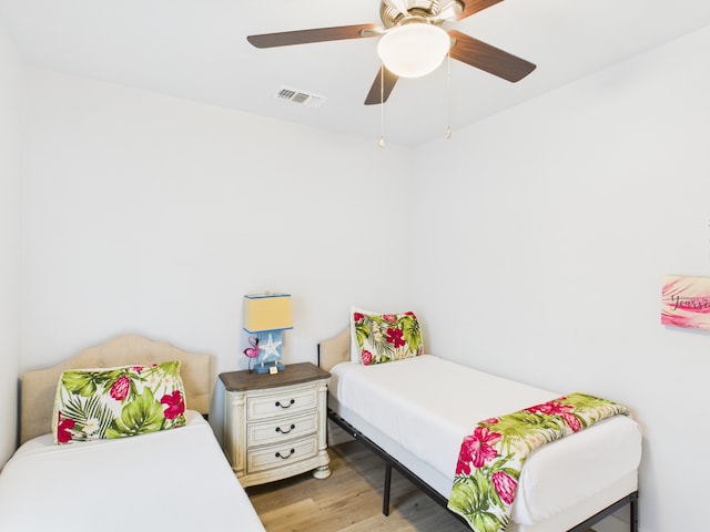 2403 S Bronte St, Rockport, TX 78382 - bedroom with light wood-style flooring and ceiling fan