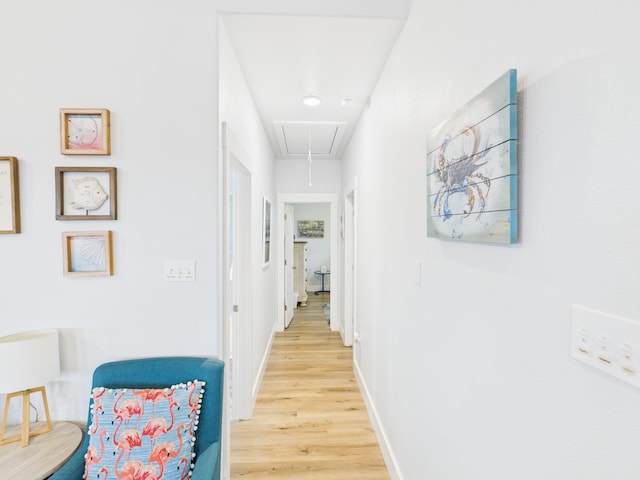 2403 S Bronte St, Rockport, TX 78382 - hall featuring attic access, light wood-style flooring, and baseboards