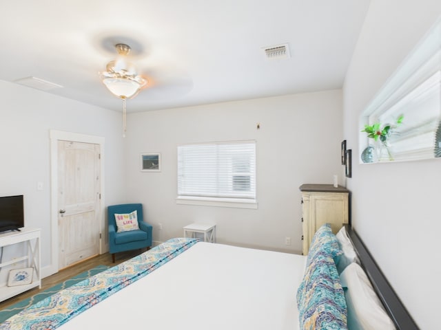 2403 S Bronte St, Rockport, TX 78382 - bedroom featuring multiple windows and wood finished floors