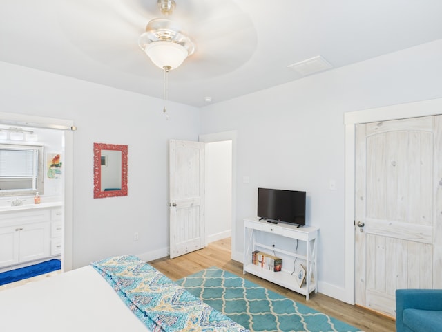 2403 S Bronte St, Rockport, TX 78382 - bedroom featuring light wood finished floors, a sink, and baseboards