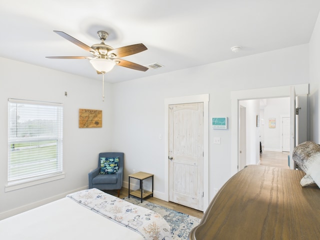 2403 S Bronte St, Rockport, TX 78382 - bedroom with wood finished floors, ceiling fan, and baseboards