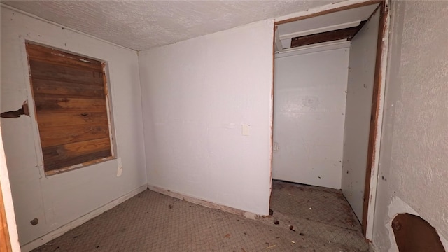 1203 Boulevard St, Bryan, TX 77803 - unfurnished bedroom with a textured ceiling
