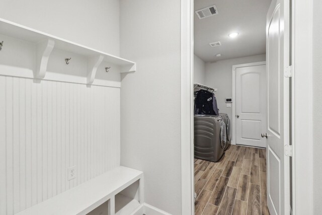 531 Campbell Dr, League City, TX 77573 - mudroom with washing machine and clothes dryer, wood finished floors, and baseboards