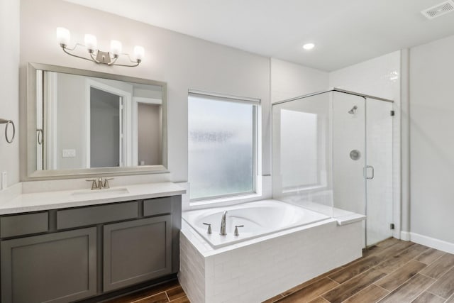 531 Campbell Dr, League City, TX 77573 - bathroom featuring a shower stall, a garden tub, vanity, and wood finished floors