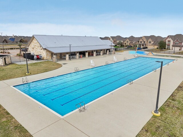 531 Campbell Dr, League City, TX 77573 - community pool featuring a residential view and a patio