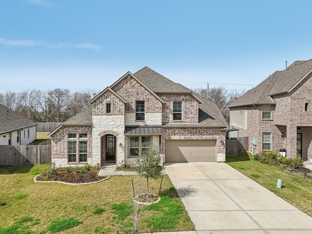 531 Campbell Dr, League City, TX 77573 - french provincial home featuring brick siding, driveway, roof with shingles, an attached garage, and stone siding