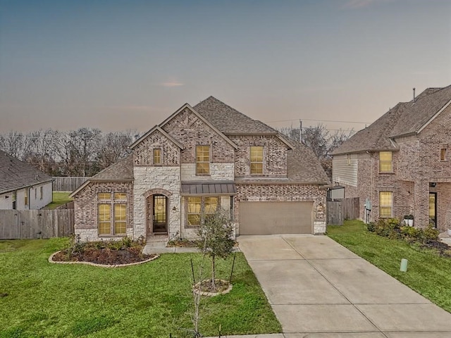 531 Campbell Dr, League City, TX 77573 - french provincial home featuring brick siding, driveway, an attached garage, and roof with shingles