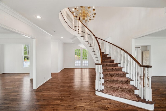10918 Wickline Dr, Hunters Creek Village, TX 77024 - stairway with wood finished floors, a chandelier, ornamental molding, baseboards, and recessed lighting