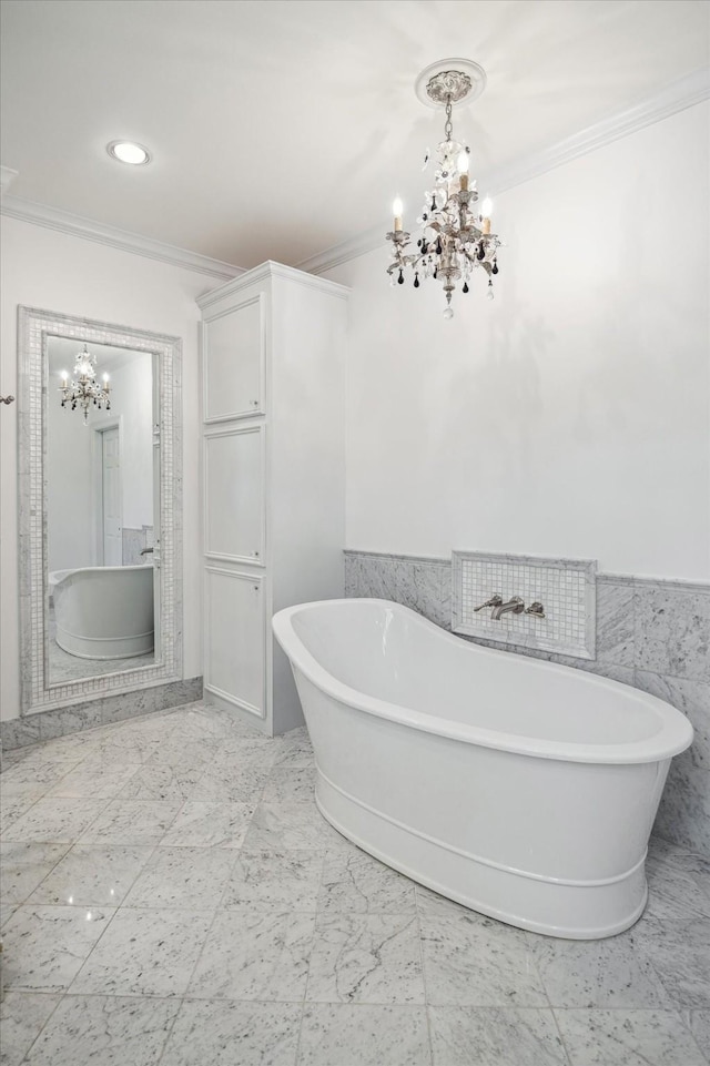 10918 Wickline Dr, Hunters Creek Village, TX 77024 - full bath with a chandelier, ornamental molding, a freestanding tub, marble finish flooring, and tile walls