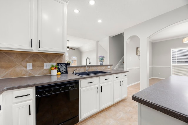 3639 Burning Palms Ct, Houston, TX 77042 - kitchen featuring dishwasher, a sink, arched walkways, dark countertops, and decorative backsplash
