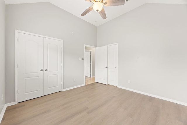 3639 Burning Palms Ct, Houston, TX 77042 - unfurnished bedroom with high vaulted ceiling, light wood-style flooring, baseboards, and a ceiling fan