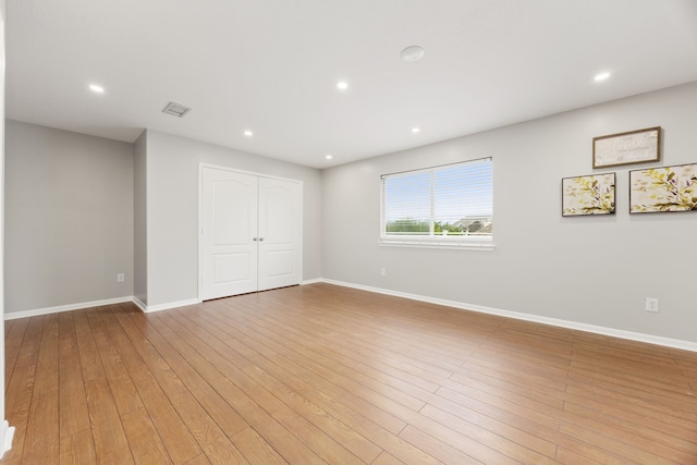 3639 Burning Palms Ct, Houston, TX 77042 - empty room with wood finished floors, baseboards, and recessed lighting