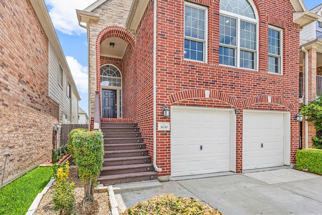 3639 Burning Palms Ct, Houston, TX 77042 - view of front of house featuring a garage, concrete driveway, and brick siding