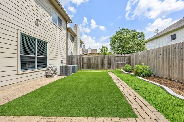 3639 Burning Palms Ct, Houston, TX 77042 - view of yard featuring central AC unit and a patio