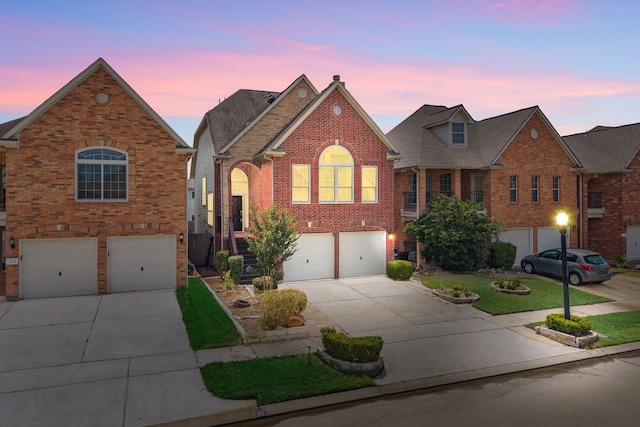 3639 Burning Palms Ct, Houston, TX 77042 - traditional home featuring an attached garage, concrete driveway, and brick siding