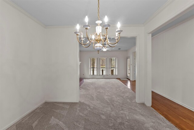 1925 E Lake Dr, Huntsville, TX 77340 - empty room featuring a chandelier, ornamental molding, carpet, and baseboards