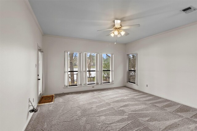 1925 E Lake Dr, Huntsville, TX 77340 - empty room with ceiling fan, carpet floors, crown molding, and a water view
