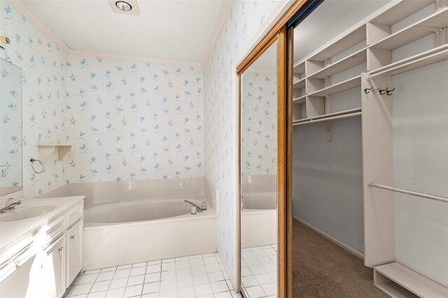 1925 E Lake Dr, Huntsville, TX 77340 - full bath with wallpapered walls, a bath, vanity, and a spacious closet