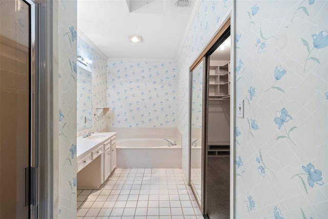 1925 E Lake Dr, Huntsville, TX 77340 - bathroom featuring vanity, wallpapered walls, a walk in closet, a garden tub, and crown molding