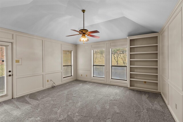 1925 E Lake Dr, Huntsville, TX 77340 - carpeted spare room with a decorative wall, ceiling fan, and vaulted ceiling