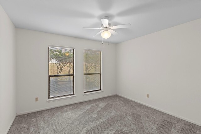 1925 E Lake Dr, Huntsville, TX 77340 - carpeted spare room with ceiling fan and baseboards