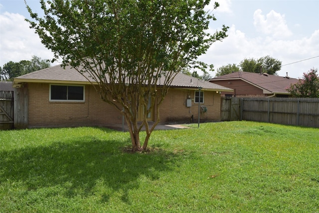 611 Glenvale Dr, Houston, TX 77060 - back of house featuring brick siding and a gate