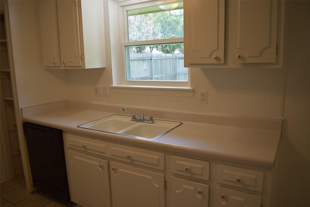 611 Glenvale Dr, Houston, TX 77060 - kitchen with black dishwasher, a sink, white cabinets, and light countertops