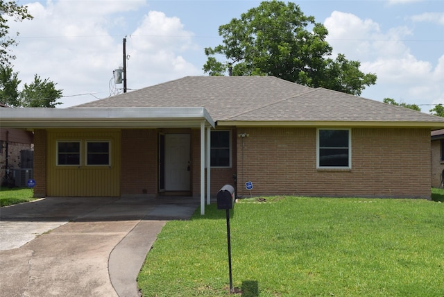 611 Glenvale Dr, Houston, TX 77060 - ranch-style home with a shingled roof, brick siding, a front lawn, central AC, and concrete driveway