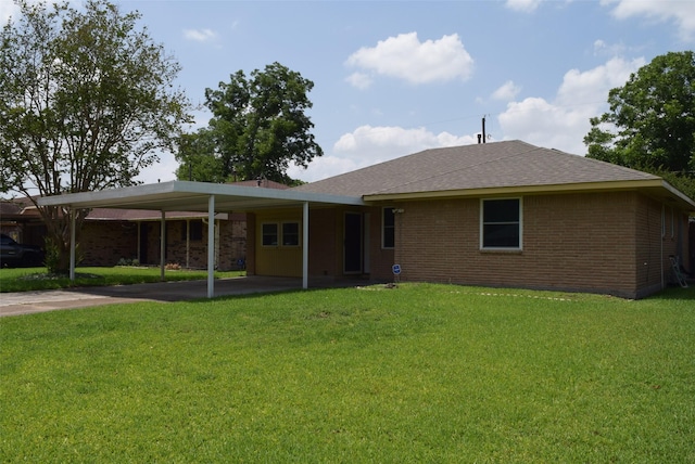 611 Glenvale Dr, Houston, TX 77060 - view of front of property with brick siding, a front lawn, and a carport