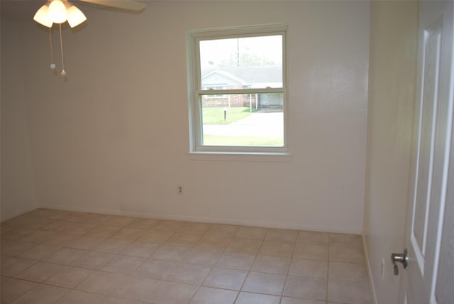 611 Glenvale Dr, Houston, TX 77060 - spare room featuring a ceiling fan, light tile patterned floors, and baseboards