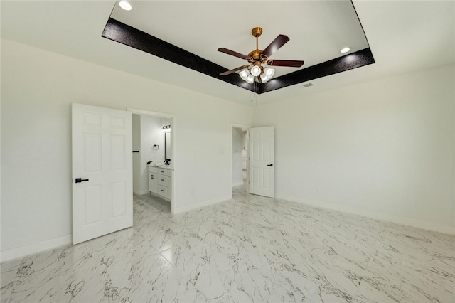6193 Rd 5503, Cleveland, TX 77327 - empty room with a raised ceiling, ceiling fan, baseboards, light marble finish flooring, and recessed lighting