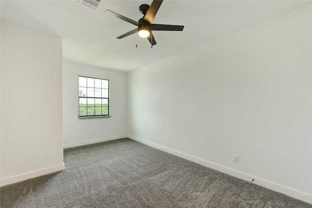 6193 Rd 5503, Cleveland, TX 77327 - empty room featuring dark carpet, baseboards, and a ceiling fan