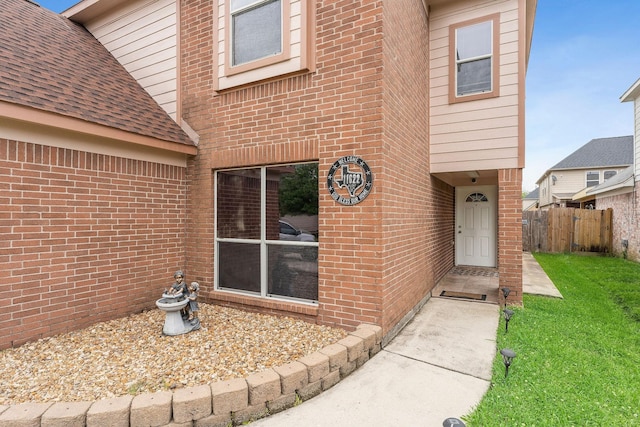 11622 Silent Elm St, Houston, TX 77044 - doorway to property with brick siding and a shingled roof