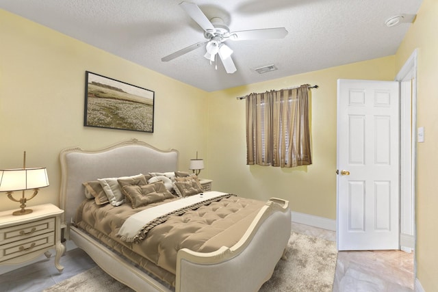 11622 Silent Elm St, Houston, TX 77044 - bedroom with a textured ceiling, ceiling fan, and baseboards