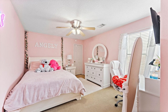 11622 Silent Elm St, Houston, TX 77044 - bedroom with light carpet, ceiling fan, and a textured ceiling