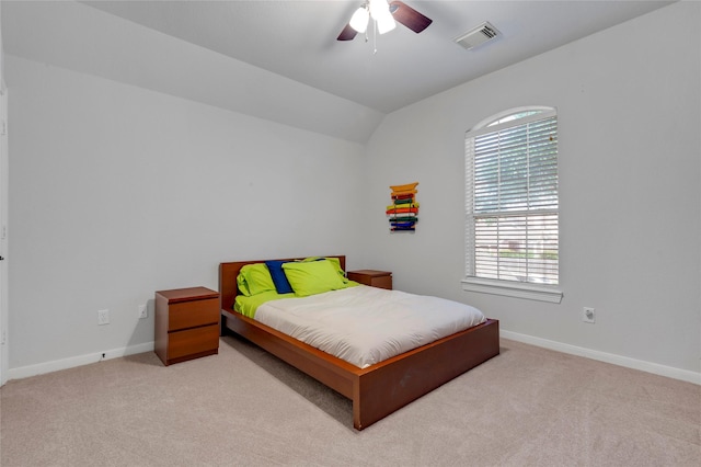 6003 Tarra Firma Dr, Spring, TX 77379 - bedroom with carpet flooring, multiple windows, vaulted ceiling, and ceiling fan