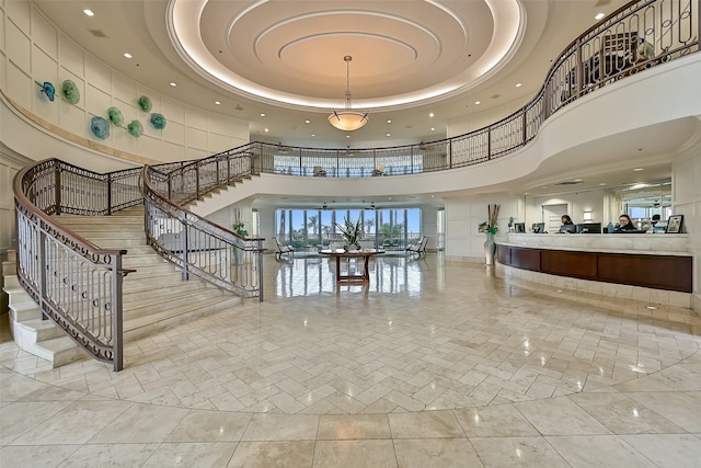 801 E Beach Dr Unit Bc2305, Galveston, TX 77550 - interior space featuring a towering ceiling, stairs, and recessed lighting
