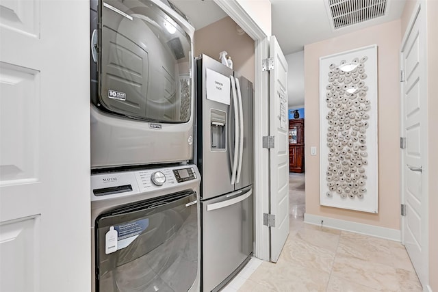 801 E Beach Dr Unit Bc2305, Galveston, TX 77550 - laundry area featuring stacked washer and clothes dryer