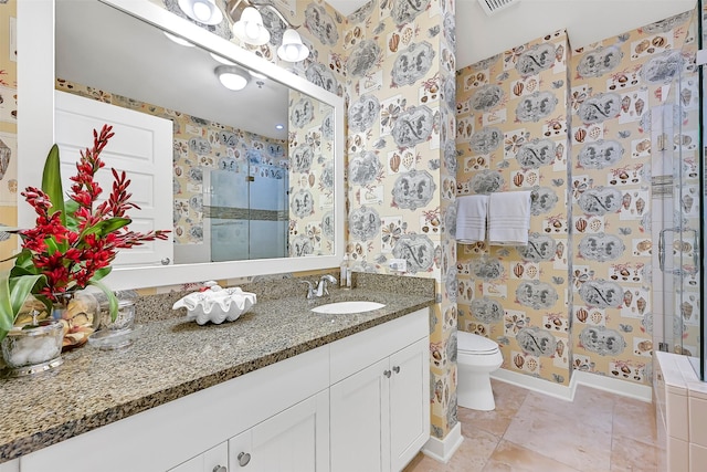 801 E Beach Dr Unit Bc2305, Galveston, TX 77550 - bathroom featuring a shower stall, vanity, toilet, wallpapered walls, and baseboards