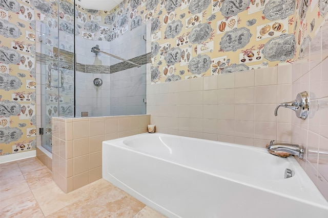 801 E Beach Dr Unit Bc2305, Galveston, TX 77550 - bathroom featuring a bath, a tile shower, and tile patterned flooring