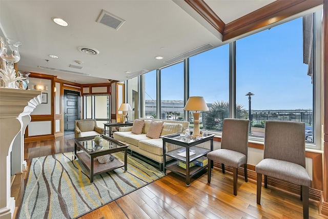 801 E Beach Dr Unit Bc2305, Galveston, TX 77550 - living area with plenty of natural light, hardwood / wood-style floors, and baseboards