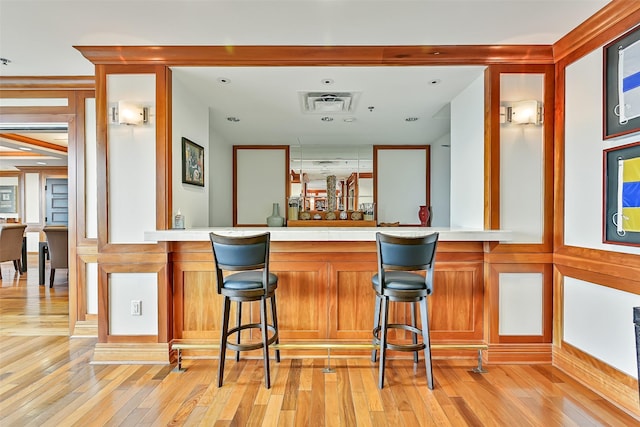 801 E Beach Dr Unit Bc2305, Galveston, TX 77550 - indoor wet bar with light wood-style flooring