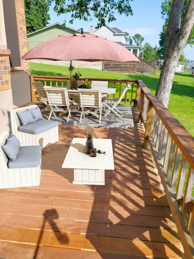 482 W Cattle Dr, Onalaska, TX 77360 - wooden deck featuring outdoor dining area and a lawn