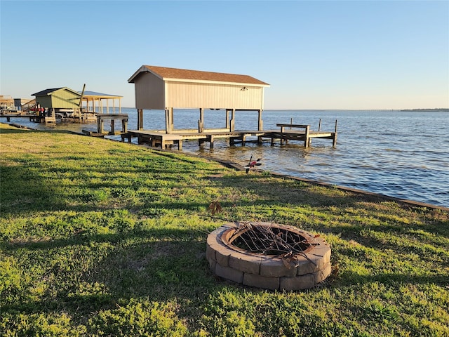 482 W Cattle Dr, Onalaska, TX 77360 - dock featuring an outdoor fire pit, a lawn, and a water view