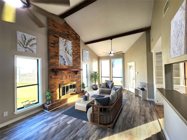 482 W Cattle Dr, Onalaska, TX 77360 - living room featuring high vaulted ceiling, beam ceiling, a brick fireplace, baseboards, and wood finished floors
