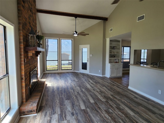482 W Cattle Dr, Onalaska, TX 77360 - unfurnished living room with a brick fireplace, high vaulted ceiling, baseboards, dark wood-style flooring, and ceiling fan