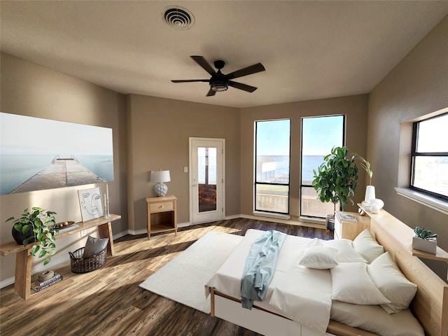 482 W Cattle Dr, Onalaska, TX 77360 - living room with a ceiling fan, dark wood-type flooring, and baseboards