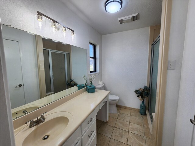 482 W Cattle Dr, Onalaska, TX 77360 - full bath featuring a shower stall, vanity, toilet, tile patterned flooring, and baseboards